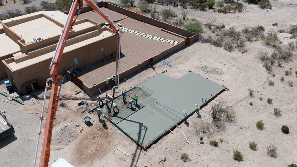 Valdez crew pouring concrete on site